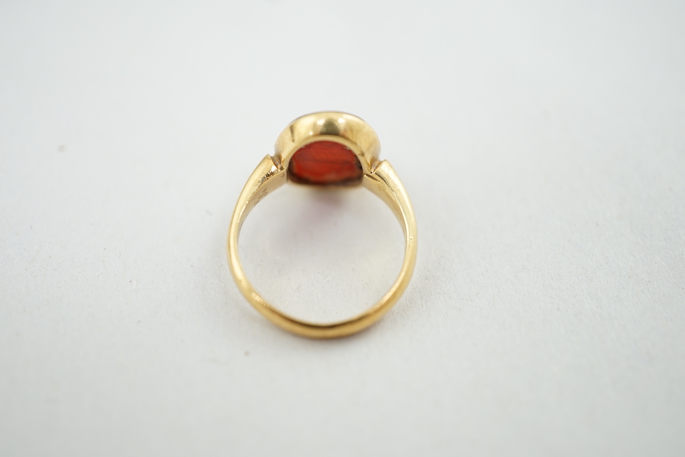 A Victorian 18ct gold and intaglio carnelian set child's signet ring